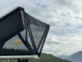 Rain-Shade-installed-on-a-James-Baroud-Nova-rooftop-tent-side-view.webp
